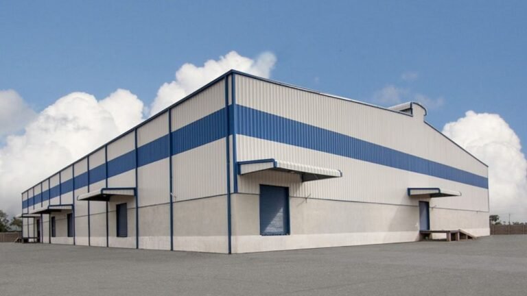 Warehouse exterior with corrugated wall cladding and entrance canopies